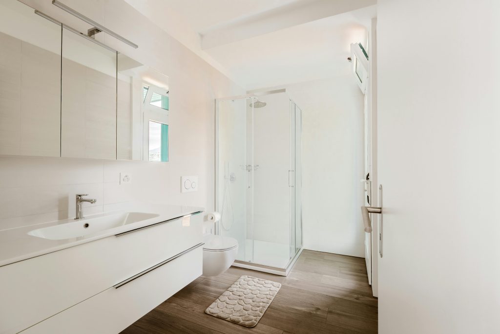 Bright, contemporary bathroom featuring white walls and minimalist design elements.